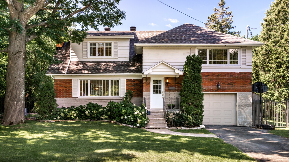 Two-story suburban brick house with attached garage