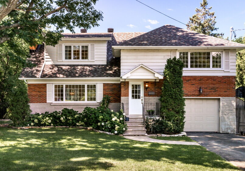 Two-story suburban brick house with attached garage
